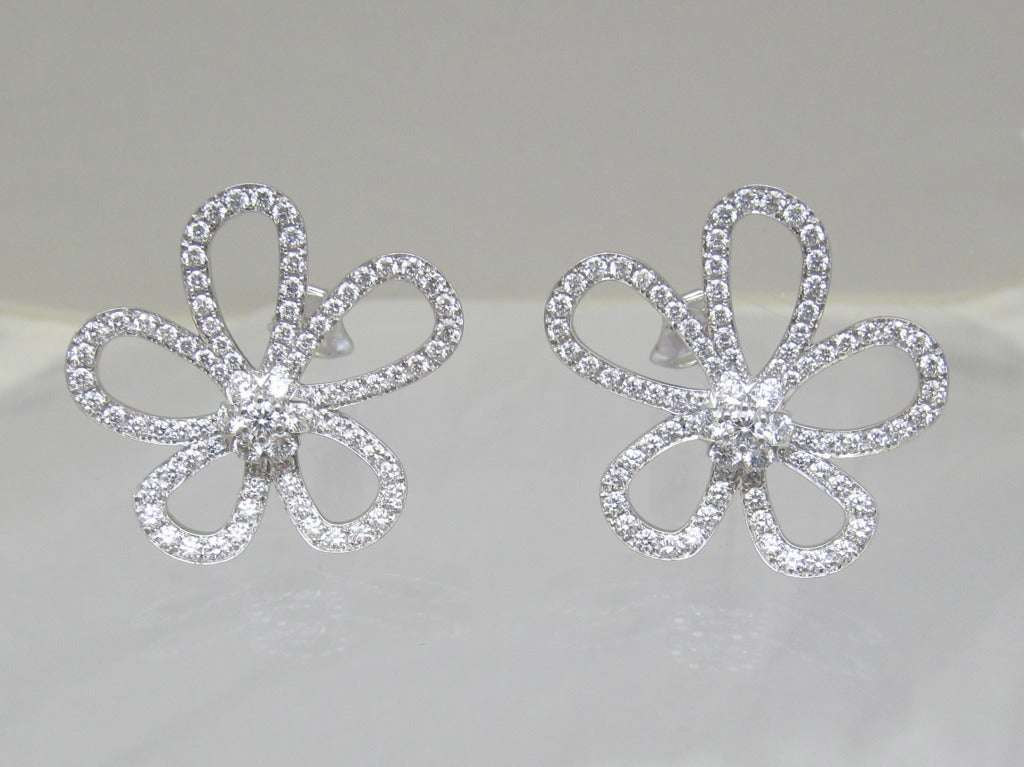 Van Cleef & Arpels Flower- Lace LARGE  Diamond Ear-clips
The Flower Lace collection plays on the transparency of lace or tulle, giving the iconic Fleurette motif a new aesthetic.
 Centered around a sparking Fleurette motif, the elegantly curved