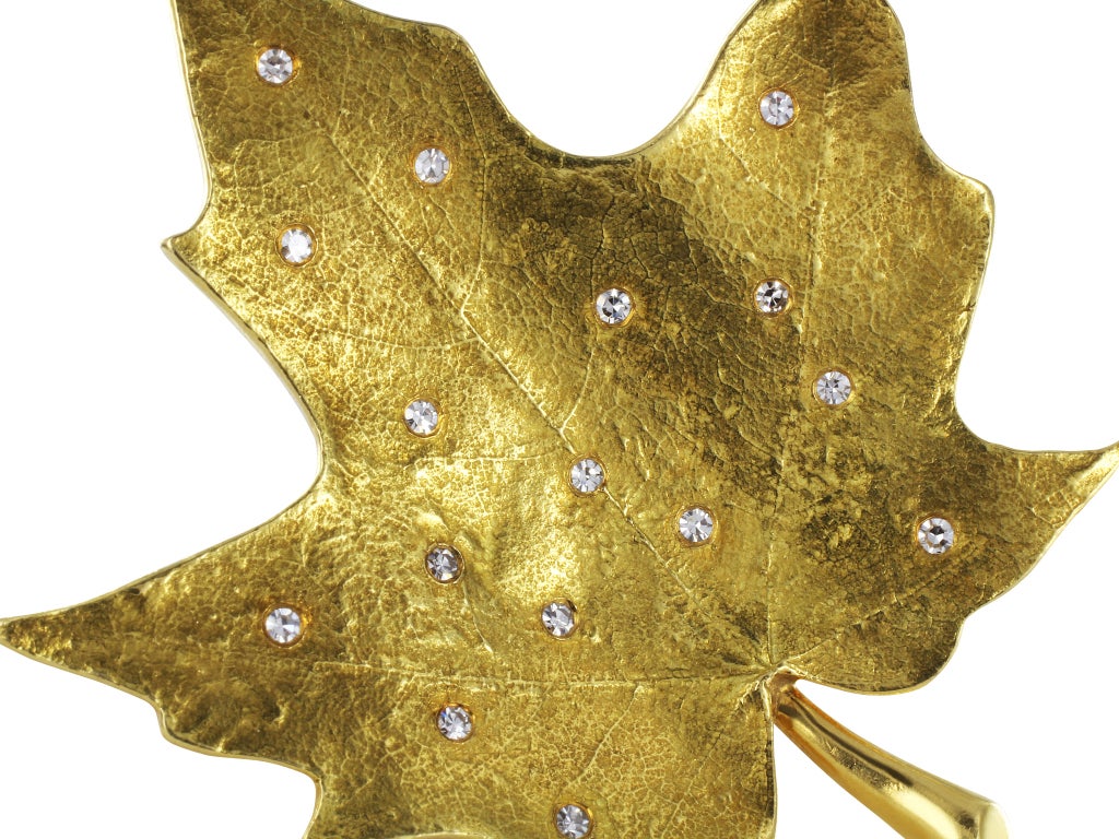 18 karat yellow gold maple leaf pin set with full cut diamond accents, signed Tiffany & Company.