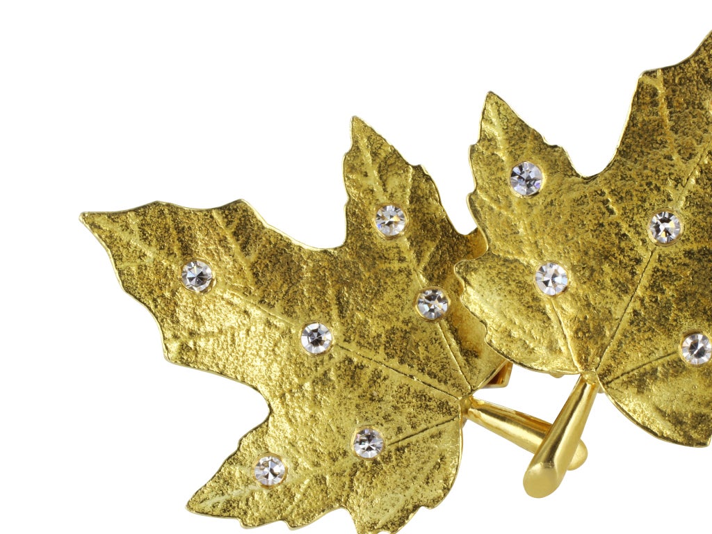 18 karat yellow gold maple leaf earrings set with full cut diamond accents, signed Tiffany & Company.