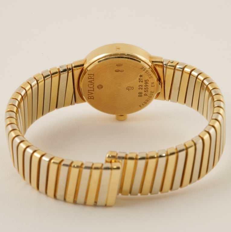 An Estate 18 karat gold watch by Bulgari. The watch is composed of a yellow and white gold open flexible tubogas band.  Dark gray dial with quartz movement. Original box. Circa 1980’s. 

Pictured in Bulgari by Daniella Mascetti and Amanda Triossi,