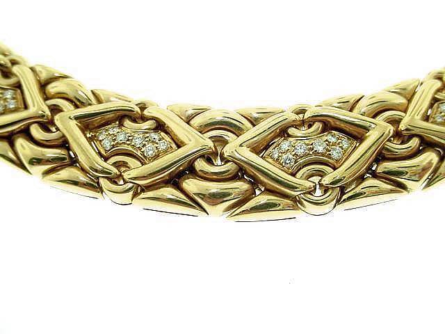 This is a dazzling designer necklace by BULGARI . . .from the Trika collection.
Nineteen  diamond sections  all the way around complete this fabulous necklace . . .152 diamonds total. . .This necklace is signed and comes in original Bulgari leather