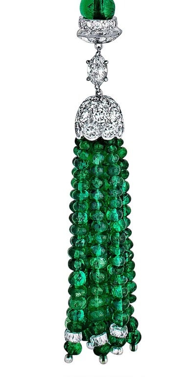 This stunning Art Deco necklace contains a bounty of rich deep green emeralds, dazzling diamonds, and natural pearls.  The 2