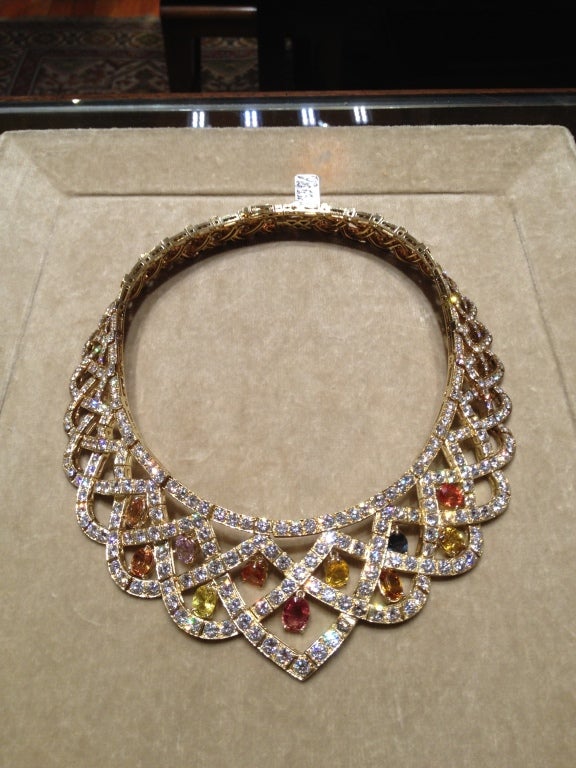 Very fine multi color sapphire and diamond neclace of loop and ribbon design mounted in 18kt yellow gold