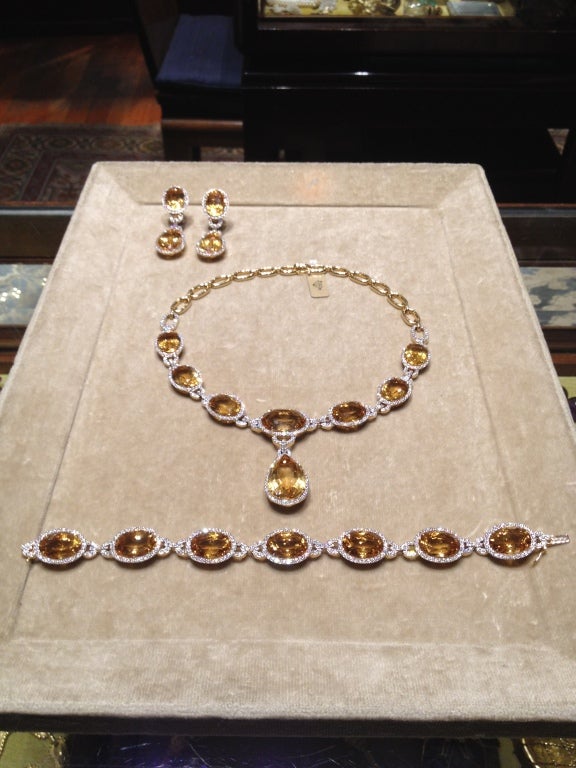 Classic modern golden citrine and diamond parure. Necklace, earrings, and bracelet mounted in 18kt yellow gold

