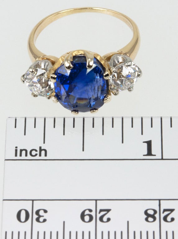 14k GORGEOUS Tiffany Sapphire ring!  The old cut sapphire has an AGL certificate stating it is Ceylon, natural, and has not been heat treated.  The weight is approximately 4.75 carats, and it is the best bluest blue!  The side diamonds are old