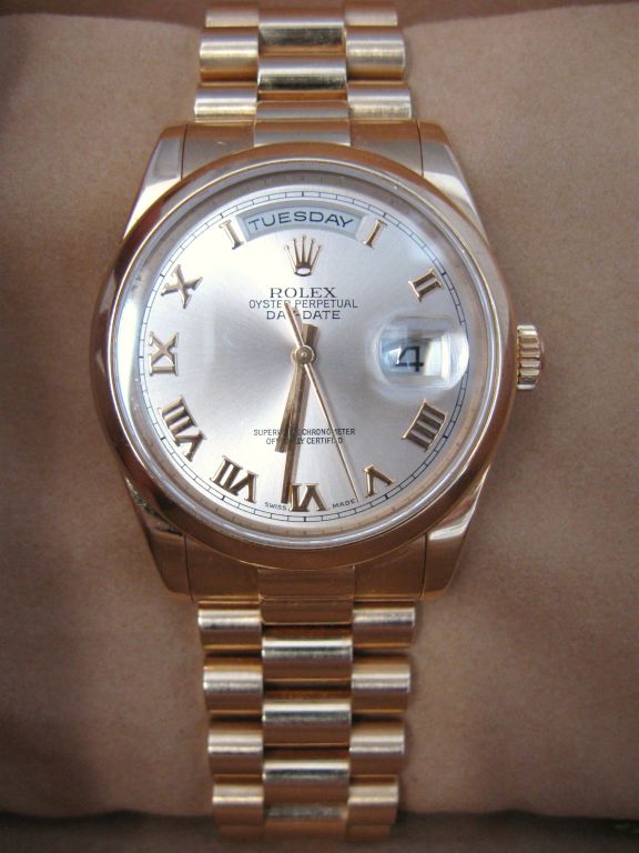 Exceptional Man's, 18K ROSE gold Rolex Presidential, Day/Date, with tags, original box, orignal label, papers etc.. <br />
Gently pre-owned, soft bezel, roman numerals on ROSE gold dial, and synthetic sapphire crystal. Day function at the 12:00
