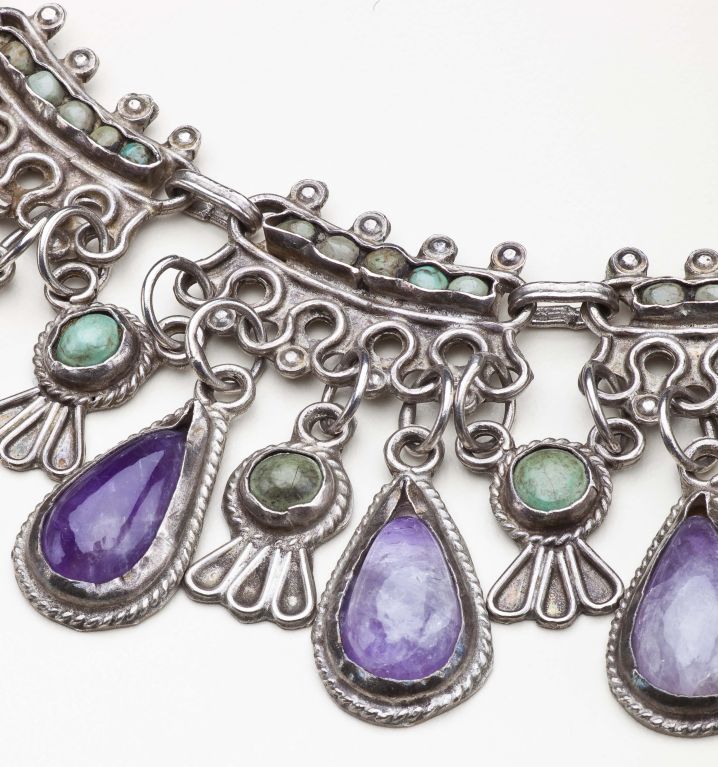 A rare necklace by Mexico City artist Matilde Poulat.  The necklace has 27 teardrop amethysts separated by turquoise drops, linked in Matl's typical style by tiny stones set in filigree silver.  The necklace is signed on the reverse with Poulat's
