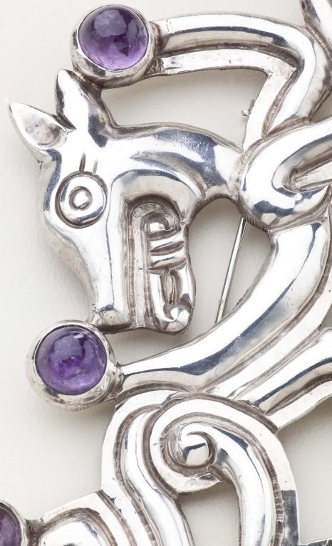 A brooch of a jaguar in sterling silver and amethysts by  William Spratling, an American artist who worked in Taxco from 1930-1967.  The jaguar was a favorite motif for Spratling and was used throughout his work both in jewelry and objects. The
