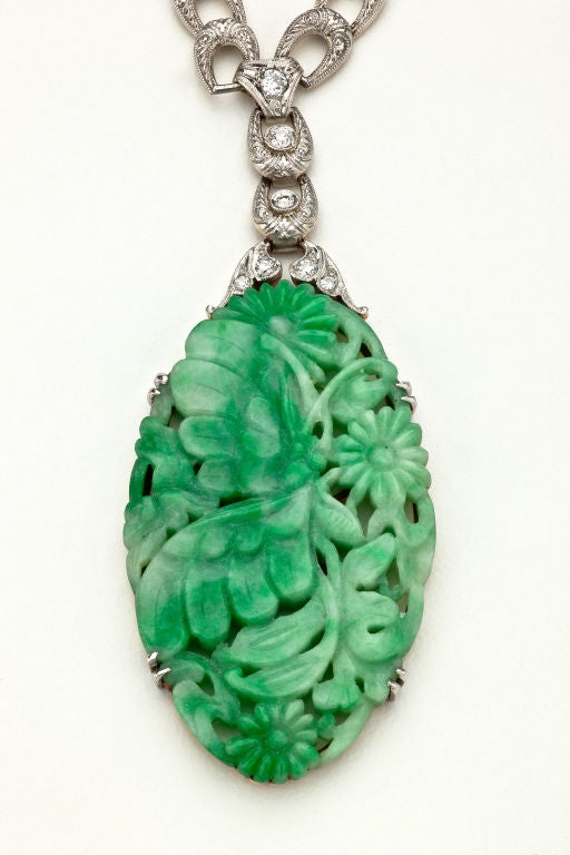 A jade and diamond pendant necklace.  The 1 3/4