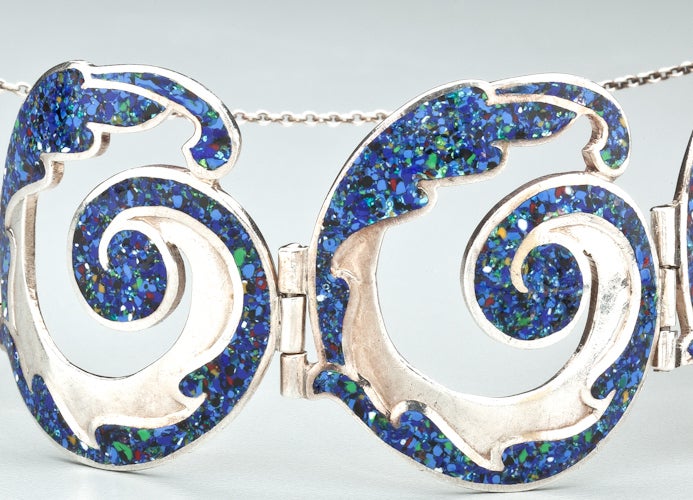 A sterling silver and enamel bracelet by Margot de Taxco.  After she left the studio of Los Castillo where she designed mostly sterling jewelry, Margot de Taxco embarked on her own style using enamel on sterling.  Her enamel was particularly