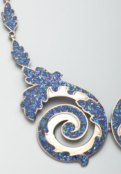 A fine enamel on sterling silver necklace by Margot de Taxco.  After she left the studio of Los Castillo, Margot de Taxco embarked on designing enameled jewelry that had the effect of stained glass.  The styles are beautiful; the technique