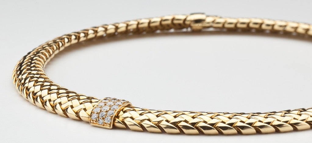 This Tiffany necklace, which matches the subsequent listing of a Tiffany bracelet and Tiffany ring, is an open basket weave design set at intervals with 38 round brilliant diamonds weighing approximately 1.5 carats.  Signed Tiffany & Co. 1995 750.