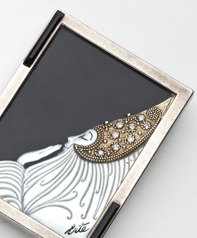 A brooch of an art deco woman by Erte in 14 karat gold, sterling silver, mother of pearl and diamonds.  The brooch is typical Erte  designed with an elongated female form with gold and diamond turban and flowing white mother of pearl gown against an