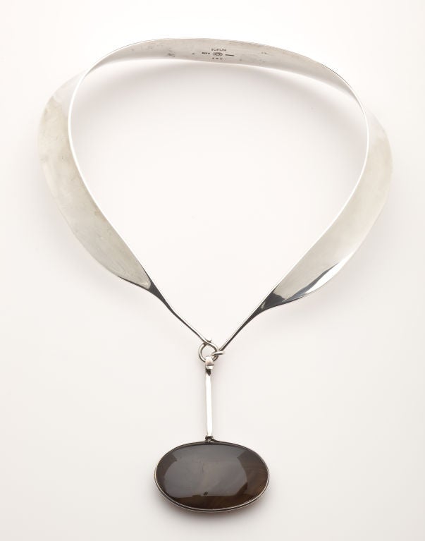 A classic modern neckring and agate pendant by Viviana Torun Bulow-Hube for Georg Jensen.  An example of this necklace was included in the milestone exhibit of modern design, 