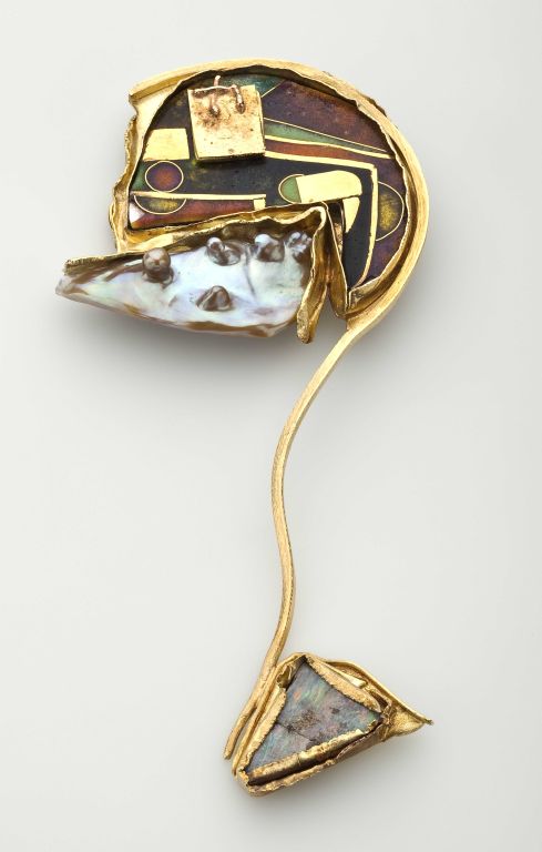 A abstract profile shaped brooch designed  by American sculptor, William Harper.  Titled 