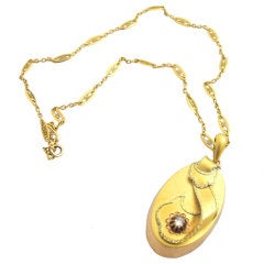 Gold Locket with Ribbon Motif and Rose Cut Diamond