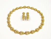 A Boucheron Gold Necklace & Ear Clips.