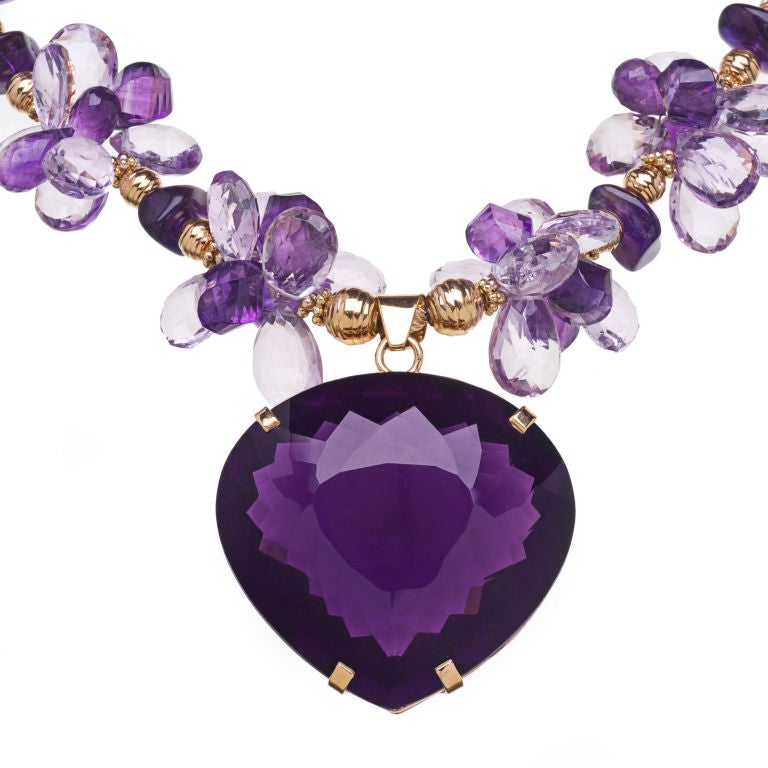 191 carat amethyst pendant on a necklace of pink and purple amethyst and 18K gold.
