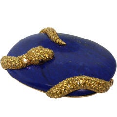 CARVIN FRENCH. A Lapis Lazuli Colored Diamond Brooch.