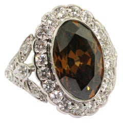 Fancy Dark Orangey Brown Oval-shaped Diamond Ring.