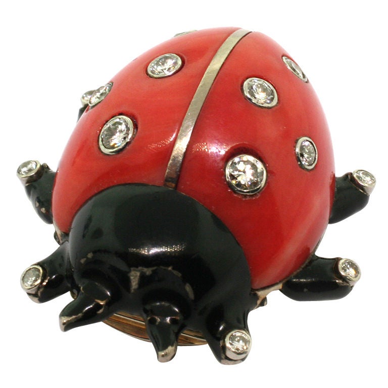 The shell of the ladybird composed of domed coral accented with collet-set diamonds, the body applied with black lacquer, the feet accented with brilliant-cut diamonds, 1970s Commande Speciale, signed Cartier Paris and numbered P6782, maker's mark