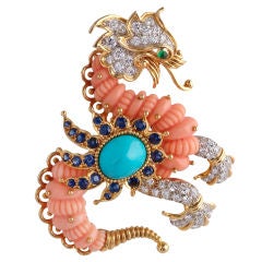 CARTIER A Coral Turquoise Diamond Griffin Brooch