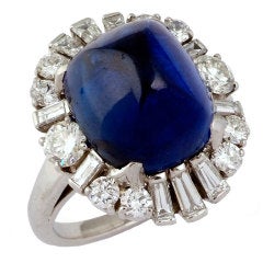 A Cabochon Sapphire and Diamond Ring.