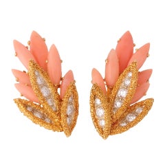 CUSI. Pair Of Coral And Diamond Ear Clips.