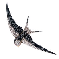 An Art Nouveau Enamel and Diamond Bird brooch.