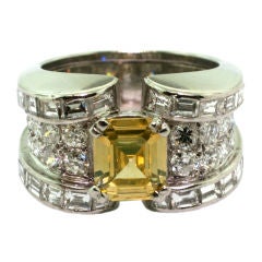 RENE BOIVIN. A Platinum Diamond and Coloured Diamond ring.
