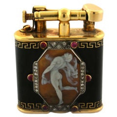 ALFRED DUNHILL. A Carved Shell Cameo Enamel Gold Lighter.