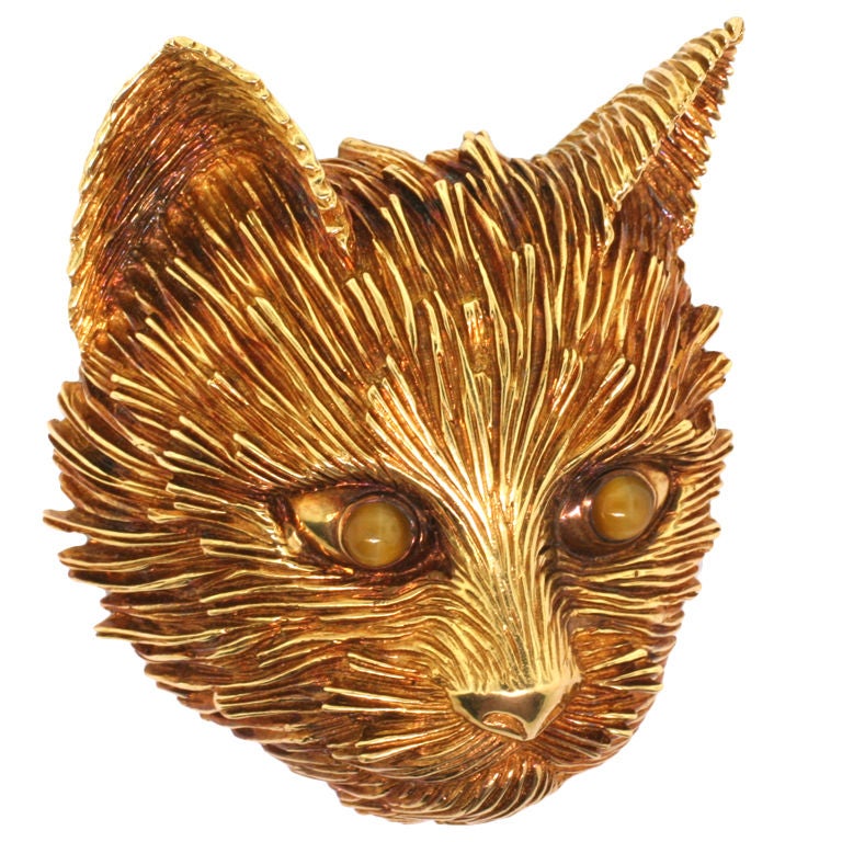TIFFANY & CO. A Yellow Gold and Cat's eye Chrysoberyl Brooch.