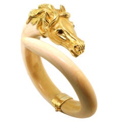 Vintage VAN CLEEF & ARPELS. A Yellow Gold Ivory Hinged Bangle.