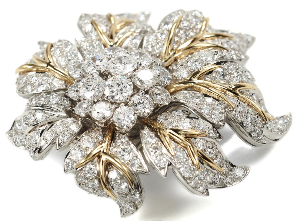 Emulating the glamour associated with earlier decades, this circa 1965 era platinum and 18k yellow gold brooch follows more of a traditional path than many other items of jewelry of the same time.  <br />
<br />
More representative and certainly