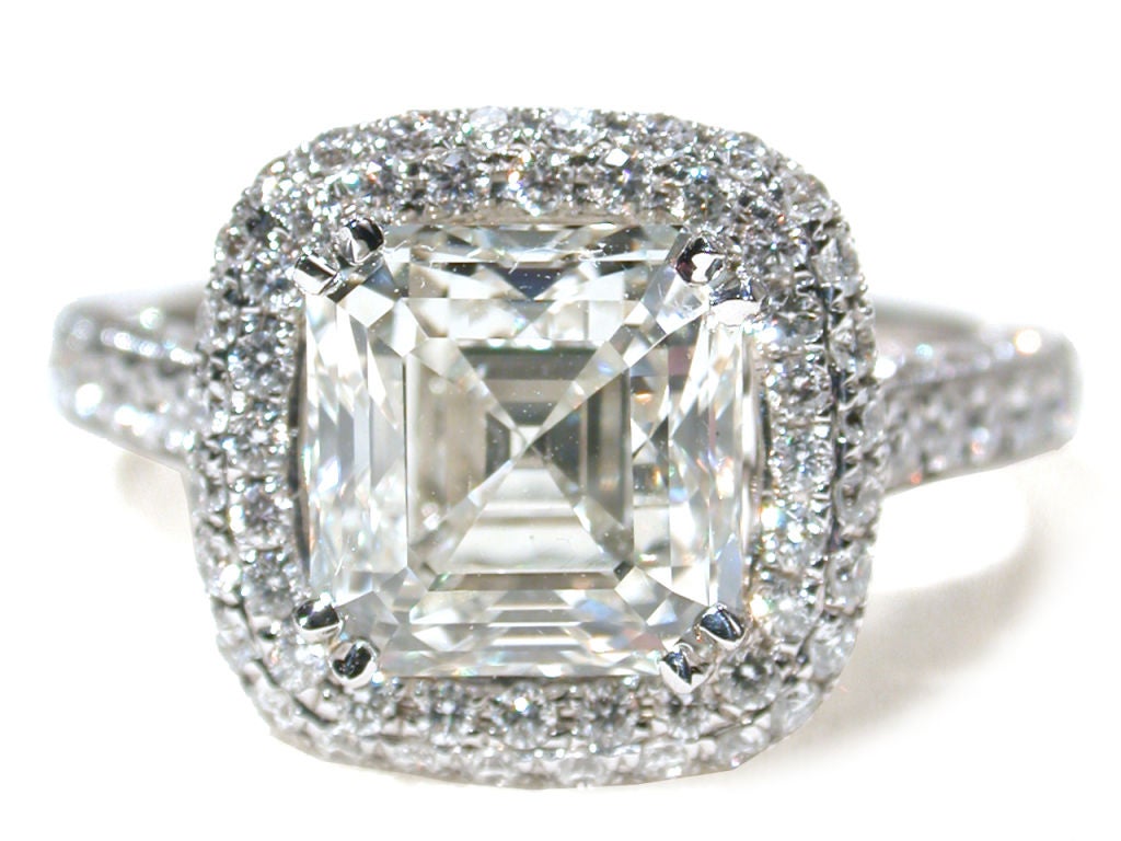 Standing out from typical modern cut stones, the Asscher cut diamond has more fire and internal refraction due to the manner in which its facets are step-cut down toward the point on the bottom (culet) of the stone. <br />
<br />
And fire is what