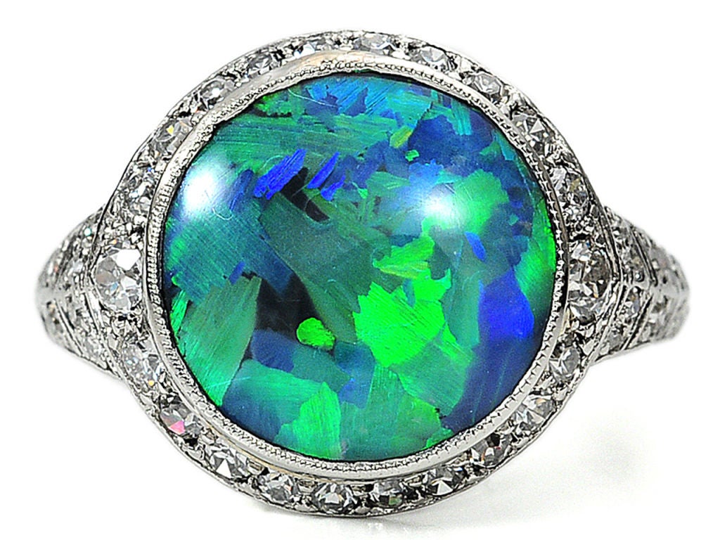 Jewelry from the Art Deco era was regarded as “uber-modern” and platinum was the ultimate metal of choice for elegance and sophistication of the age.

A fantastic black opal of an estimated 3 carats is the wow factor of this circa 1925 platinum