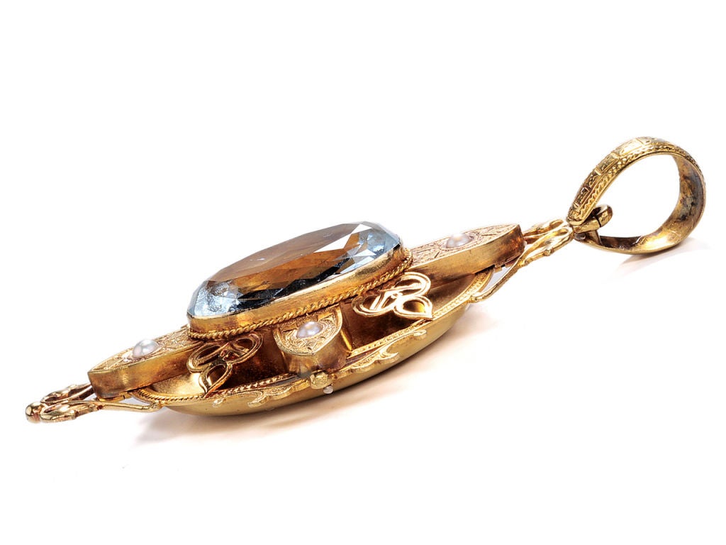 Standard & Poor’s Triple A rating has nothing on this 15k yellow gold pendant gets in the “investment” world of Victorian jewelry. Magnificently designed, the hand engraved oval pendant is set with a central faceted 11 carat (estimated) natural