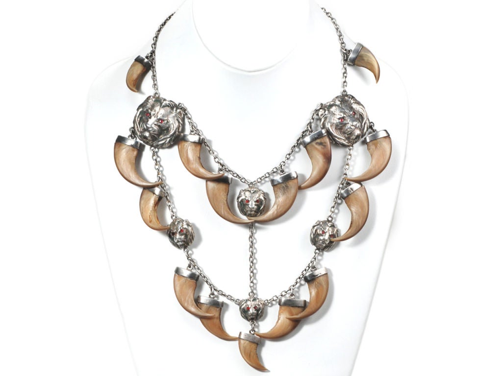 Traditionally claw jewelry has been set with those of a tiger. This bib necklace, extraordinary in its own right employs the claws of a lion. We typically associate the lion with Africa and few are aware that this noble beast also once roamed from