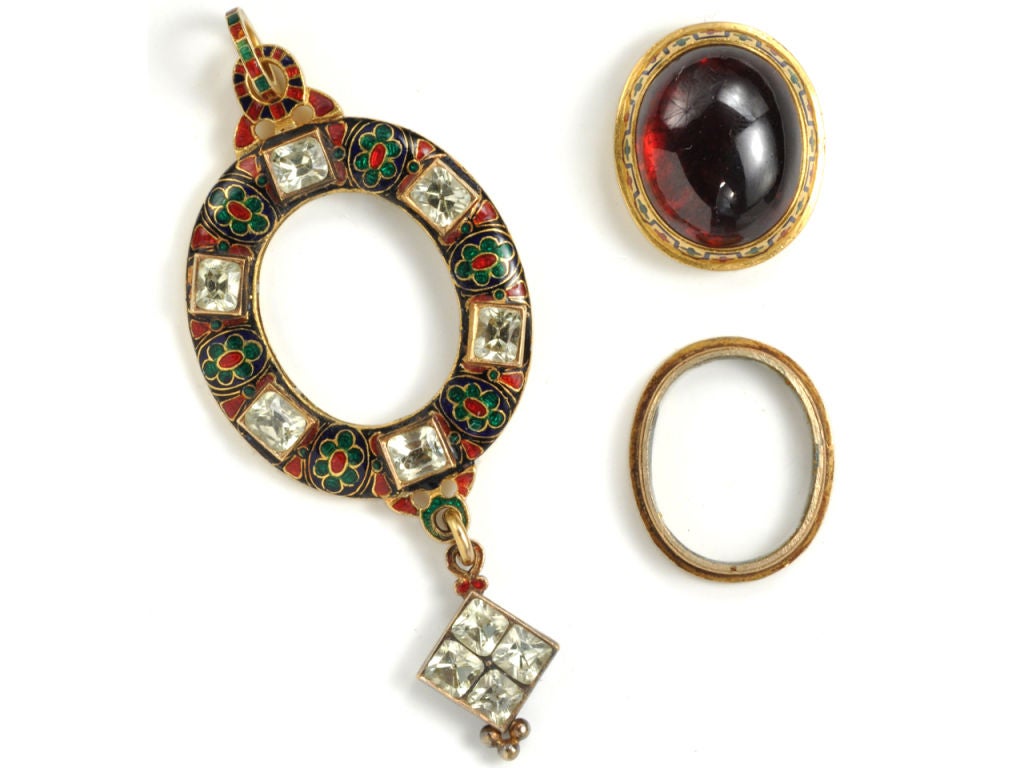 Founded in 1849, Hancocks had a reputation for creating ravishing Holbeinesque jewelry in the Victorian era, this garnet and enamel pendant adds to that already impressive jewelry archive. <br />
<br />
Although characterized by the typical