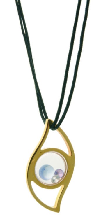 Floating eye pendant in gold