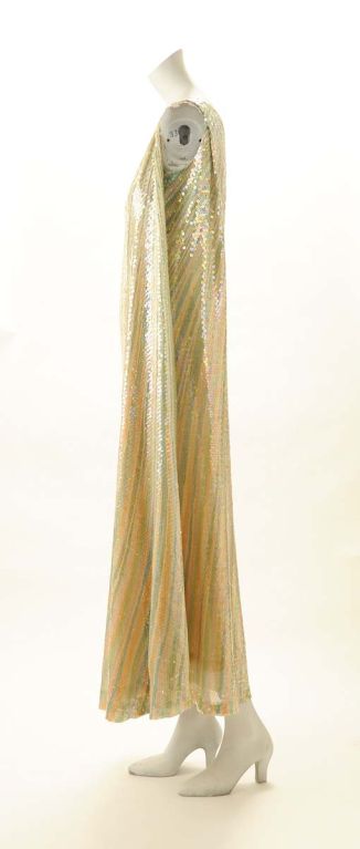 Must be seen in person ! Must be worn again ! Hand painted in flowing pastel stripes on silk chiffon over a nude silk chiffon lining and completely covered in aurora borealis sequins. It is one piece of fabric which wraps the body and attaches over