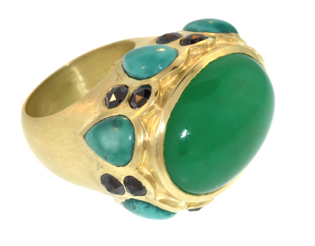 The LFrank Casbah Ring:  This striking ring is comprised of a large oval Chrysophrase cabochon, six tear drop shaped Turquoise cabochons, and twelve 3mm rose cut black diamonds, all set into a dramatic, 18k yellow gold setting.  This ring is both