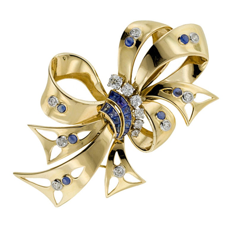 Retro Sapphire and Diamond Bow Pin For Sale