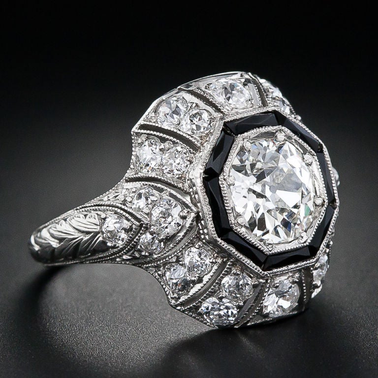 A bright and beautiful, high-quality European-cut diamond weighing 1.15 carats with a GIA report stating I color - VVS2 clarity radiates from this resplendent original Art Deco ring, circa 1925. The diamond is dramatically framed in a hexagon of