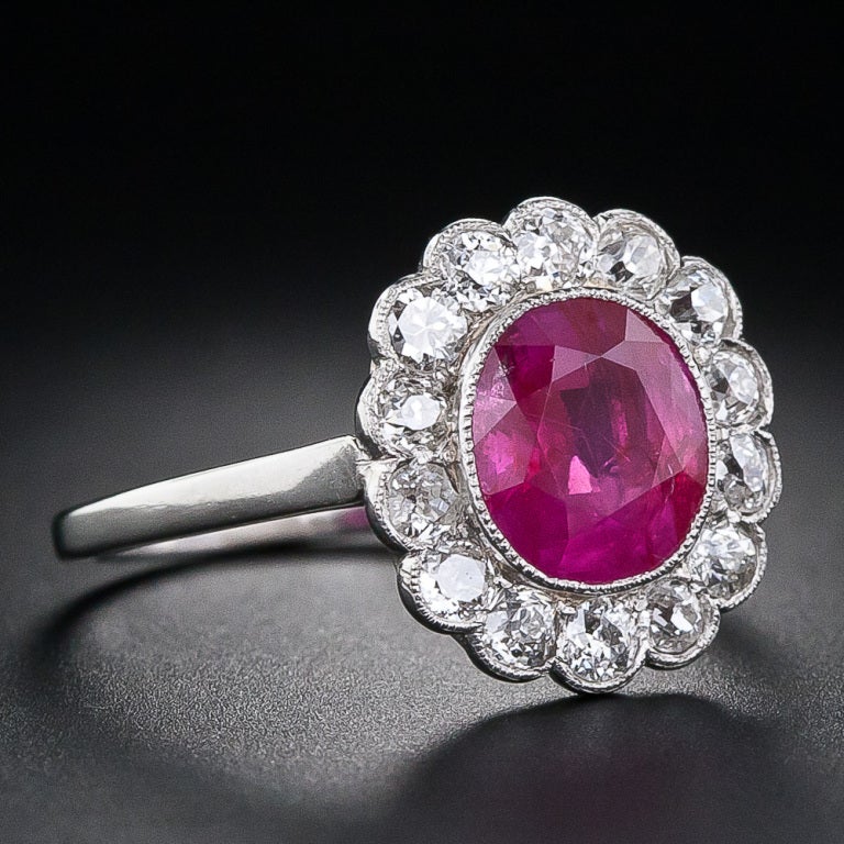 A ravishing-red, two carat, old mine, natural no-heat 'Mogok' ruby radiates from within a sparkling bright-white diamond halo in this classic Edwardian dream ring, handcrafted in platinum at the very beginning of the twentieth century. 

Inventory