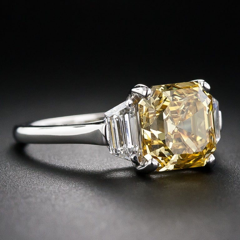 Even our very talented photographer is unable to capture the gorgeous, rich honey yellow (not a trace of brown) color of this extraordinary, original vintage Asscher-cut diamond ring - it must be viewed up-close and in person. This truly rare,