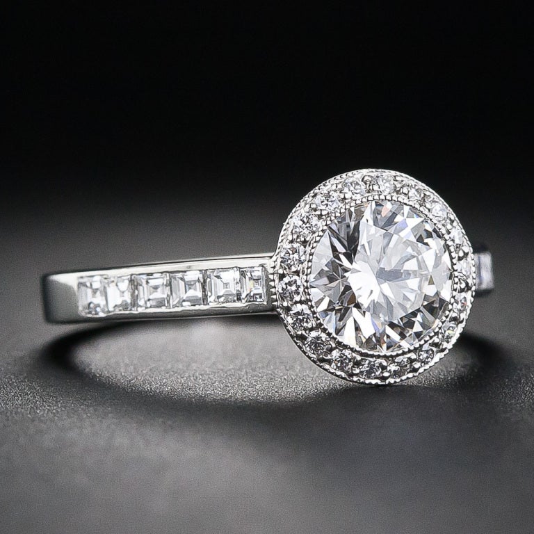 A stunningly beautiful sparkler by America's preeminent purveyor of small precious packages - Tiffany & Co. This contemporary, yet classic, engagement ring scintillates with a gorgeous, high-caliber round brilliant-cut diamond, bearing a sumptuous