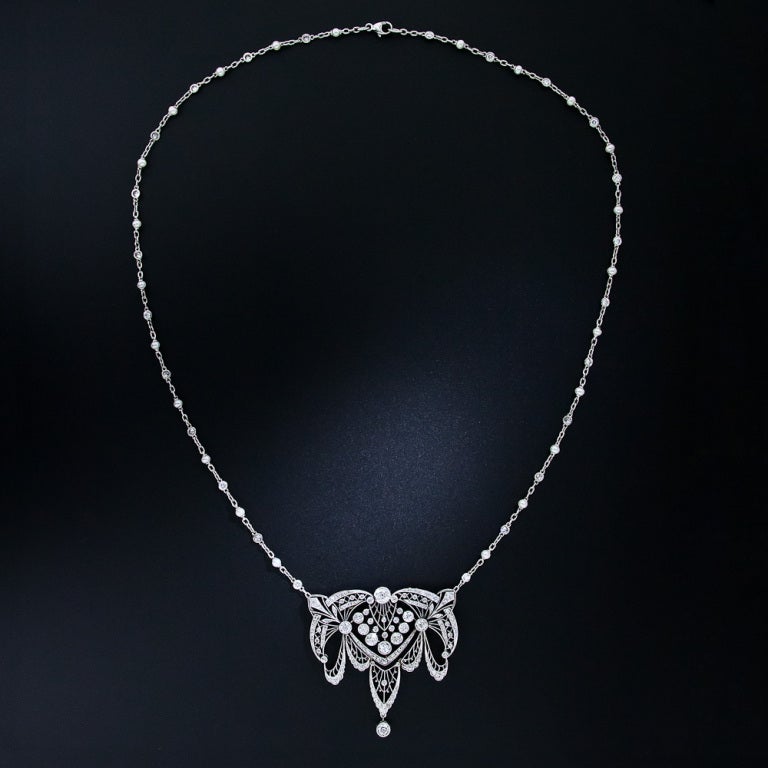 You will be the belle of the ball wearing this exquisitely beautiful platinum and diamond necklace from La Belle Époque. This light and delicate necklace is expertly pierced and set throughout with sparkling diamonds and millegrained with tiny beads