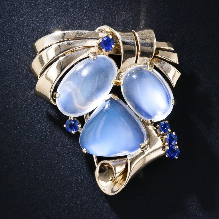 Consummate 1940s Retro artistry is beautifully captured by one of twentieth-century America?s premier jewelers - Raymond Yard - in this splendid suite of jewels designed to feature five luminous blue-flash moonstones. The shimmering gemstones are