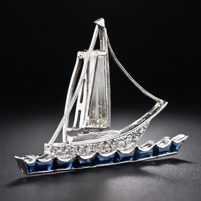 Ahoy! Just in time for the America's Cup - a platinum and diamond sailboat, the main sail of which is composed of a giant, light-yellow tapered baguette diamond, weighing 1.45 carats, with a sparkling diamond-set hull glistening in the sunshine atop